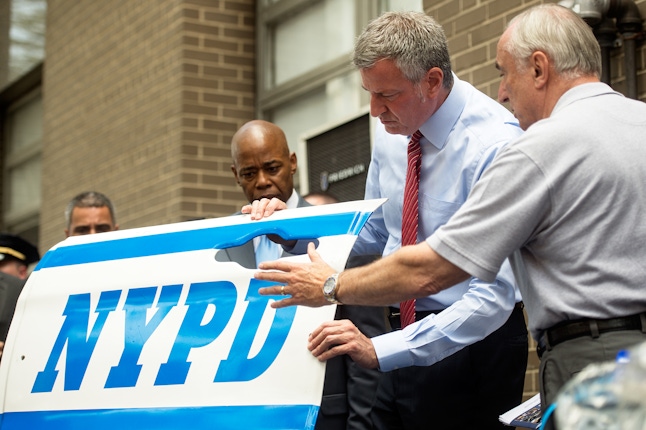 Mayor Bill de Blasio and Commissioner Bill Bratton demonstrate the new ballistic doors.